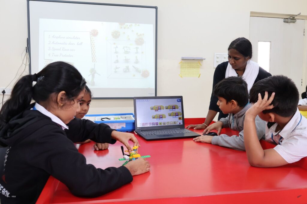 Students learning with digital technology in a smart classroom reflecting education reforms in the current Union Budget 2026.